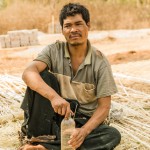 man crafting basket